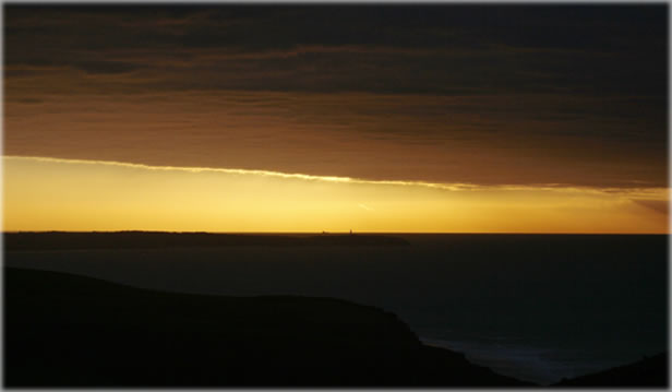 Sunset in the north of France, facing the English Channel. Photo by Eric Francis.