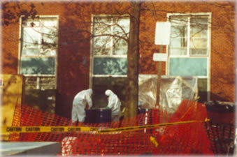 Hazardous materials workers outside dormitory at the State University of New York at New Paltz, January 1992. See photo tour for more info.