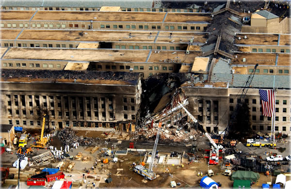 Official photo of the damage to the Pentagon on Sept. 14, 2001, supposedly due to the crash of a 
757-200 airliner filled with fuel. Original copy is here. More detailed analysis of the image is here. 
Photo by Tech. Sgt. Cedric H. Rudisill. 